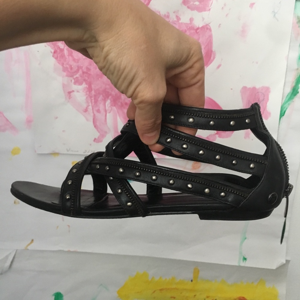 Black modern and zipper gladiator sandals.